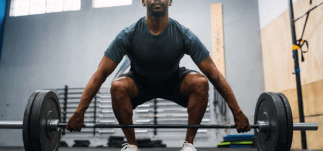 a gentleman doing front squats