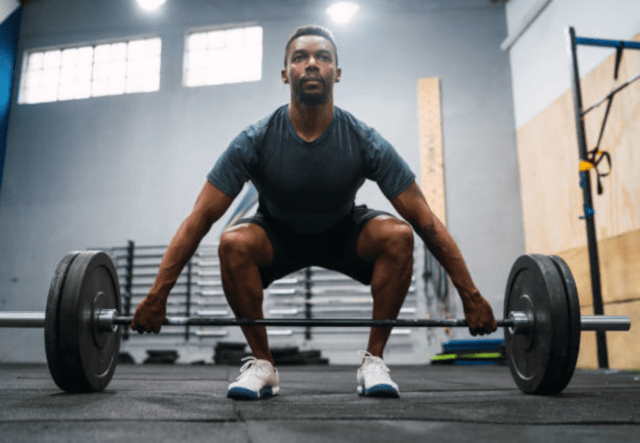 a gentleman doing front squats